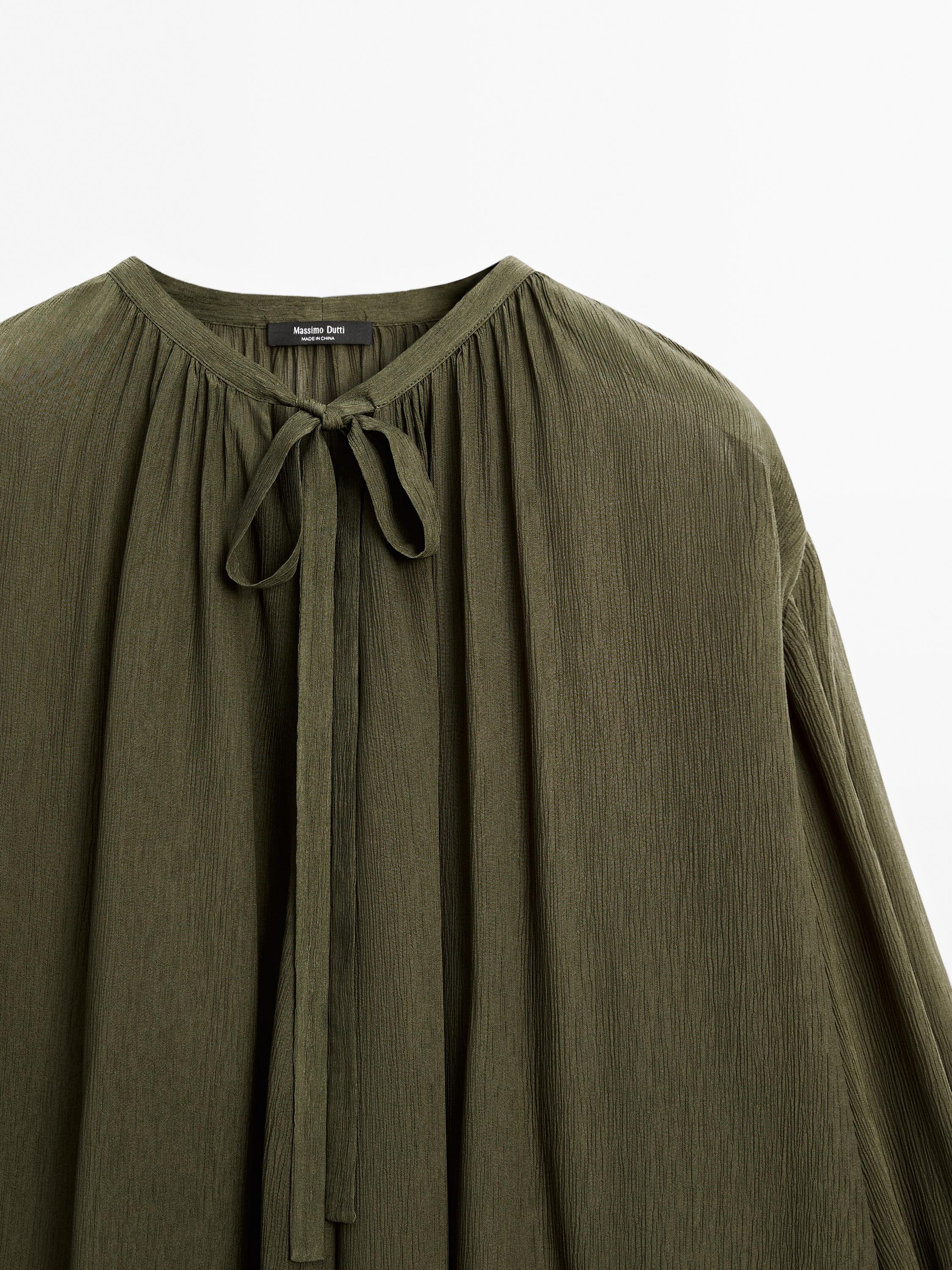 Cape blouse with ties